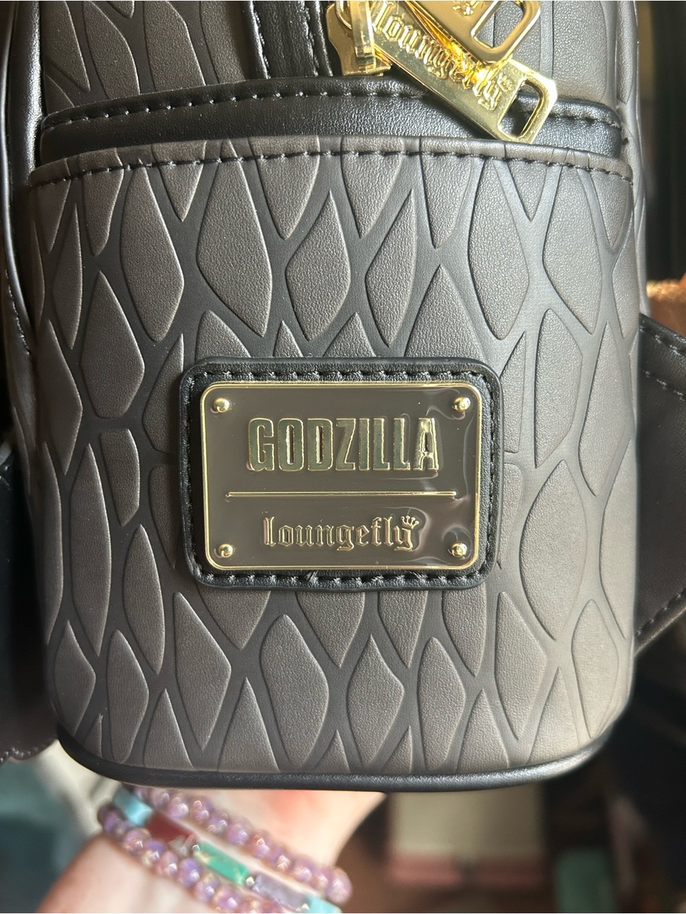 Loungefly Black Godzilla Face Backpack with Yellow and Cream Accents - Picture 6 of 6
